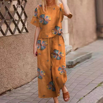 🧡【Vruća rasprodaja u Hrvatskoj】Modne cvjetne kratke rukave, ležerne hlače s devet točaka [košulja kratkih rukava + hlače] dvodijelni set